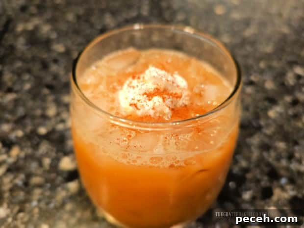 Honey Almond Iced Latte - The Grateful Girl Cooks! A honey almond iced latte, topped with whipped cream and cinnamon.