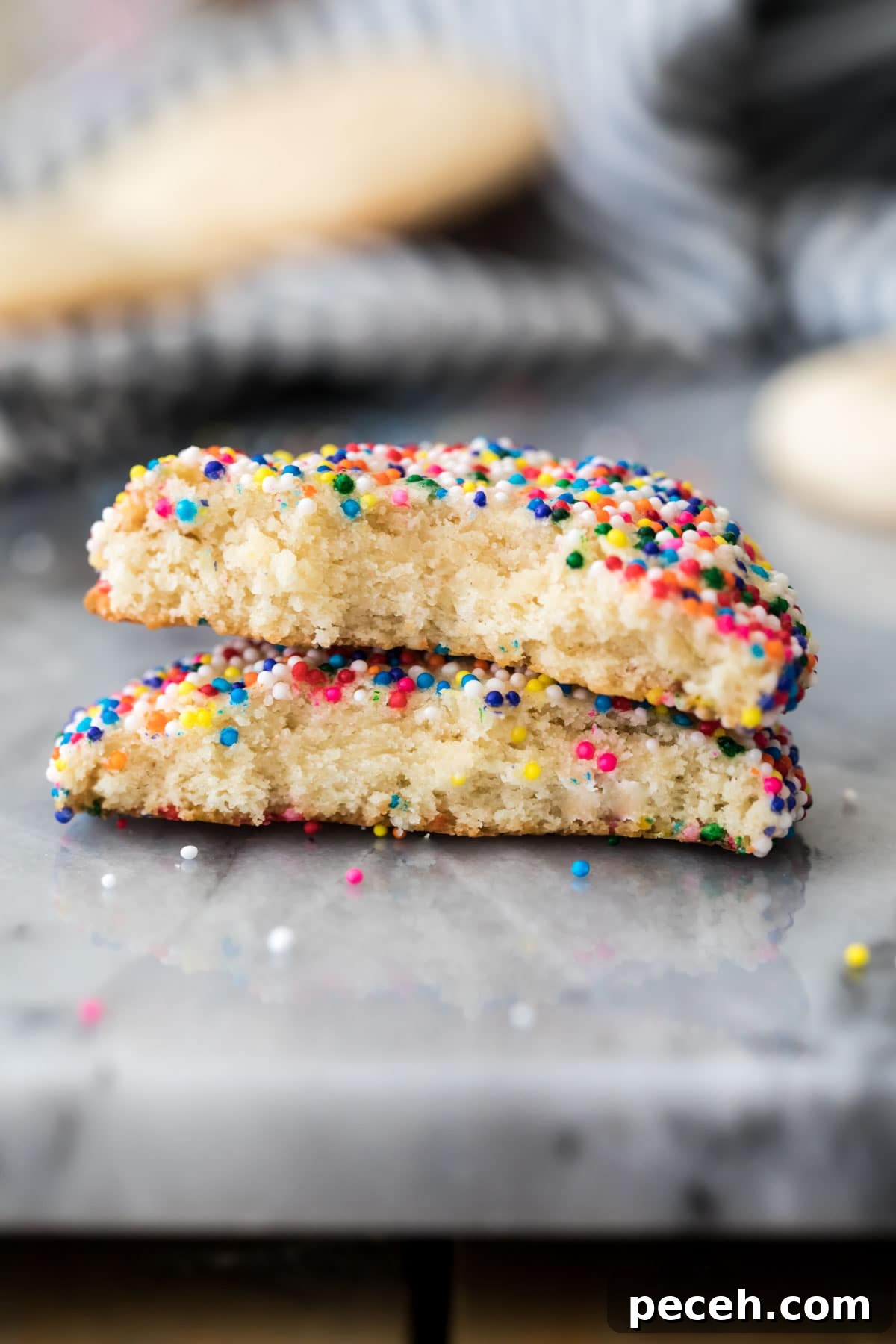 Soft and Chewy Cream Cheese Cookie Recipe for Perfect Bakes 2 cookie broken in half and stacked on top of itself