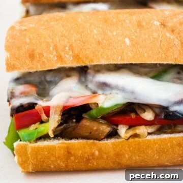 A close up view of a vegetarian mushroom philly cheesesteak sandwich.