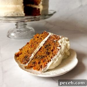 Amish Pineapple Carrot Cake with Pecans – Traditional Recipe 11 a slice of Amish carrot cake on a small plate.