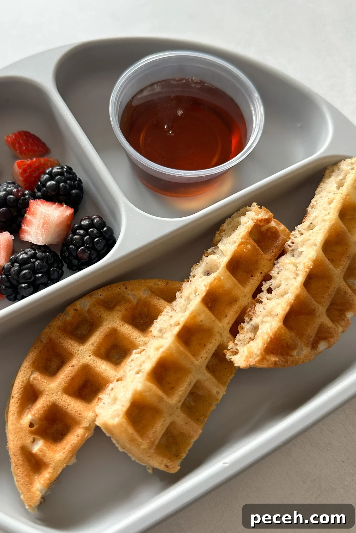 Waffle Recipes for Babies and Toddlers: 10+ Nutritious Ideas 21 Eggless waffles served with berries and maple syrup.