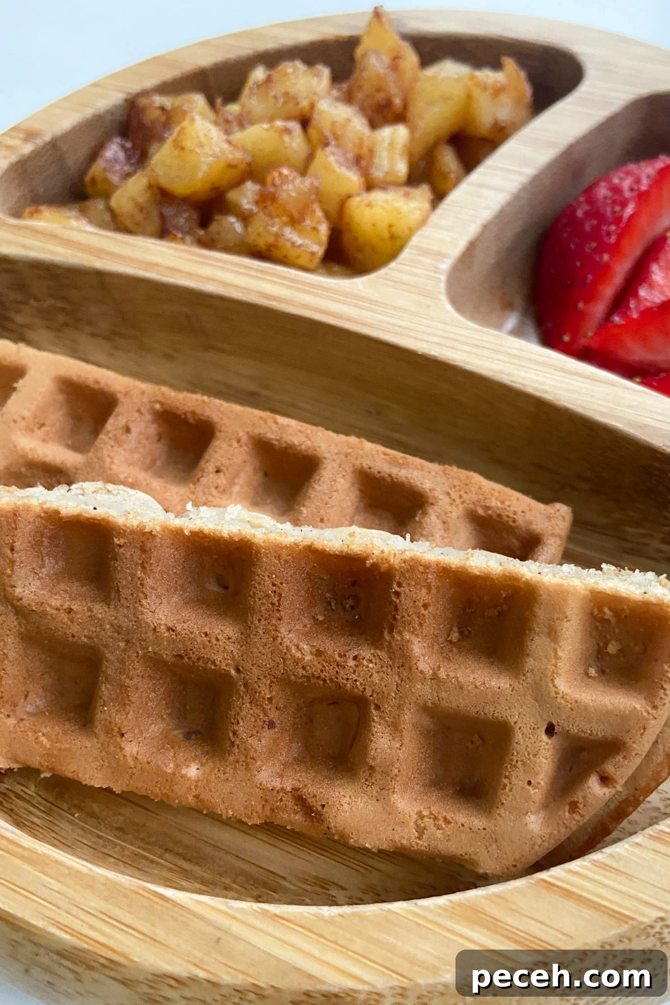 Waffle Recipes for Babies and Toddlers: 10+ Nutritious Ideas 5 Cinnamon apple waffles served with cinnamon apples and sliced strawberries