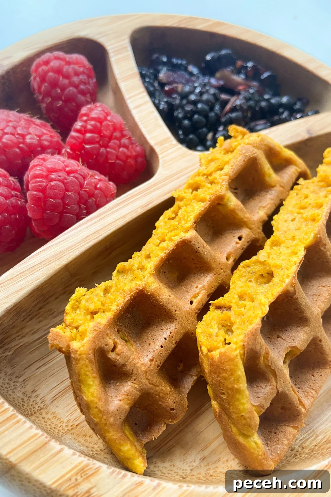Waffle Recipes for Babies and Toddlers: 10+ Nutritious Ideas 9 Pumpkin waffles served with raspberries and blackberries