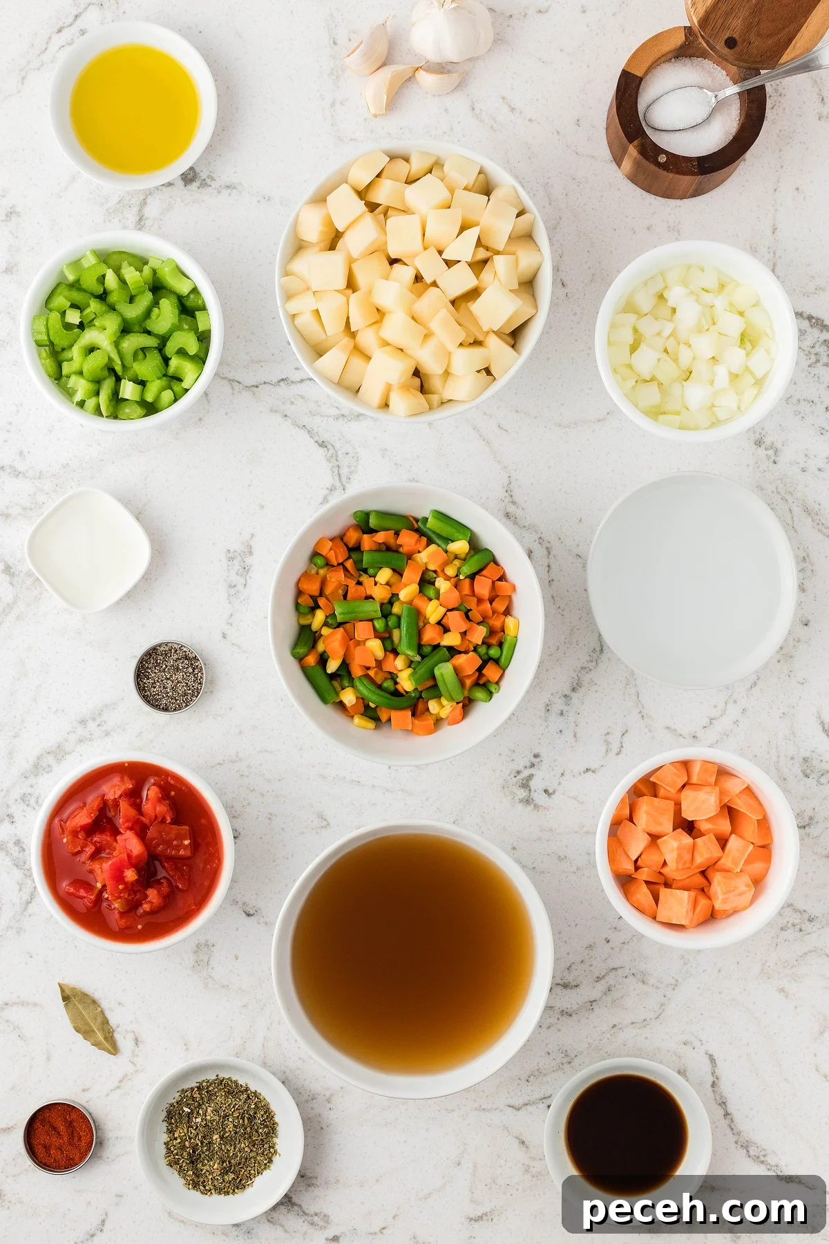 Ingredients for Instant Pot Vegetable Soup arranged in bowls on a white countertop, including fresh and frozen vegetables, broth, and seasonings—perfect for making soup in an Instant Pot or pressure cooker.