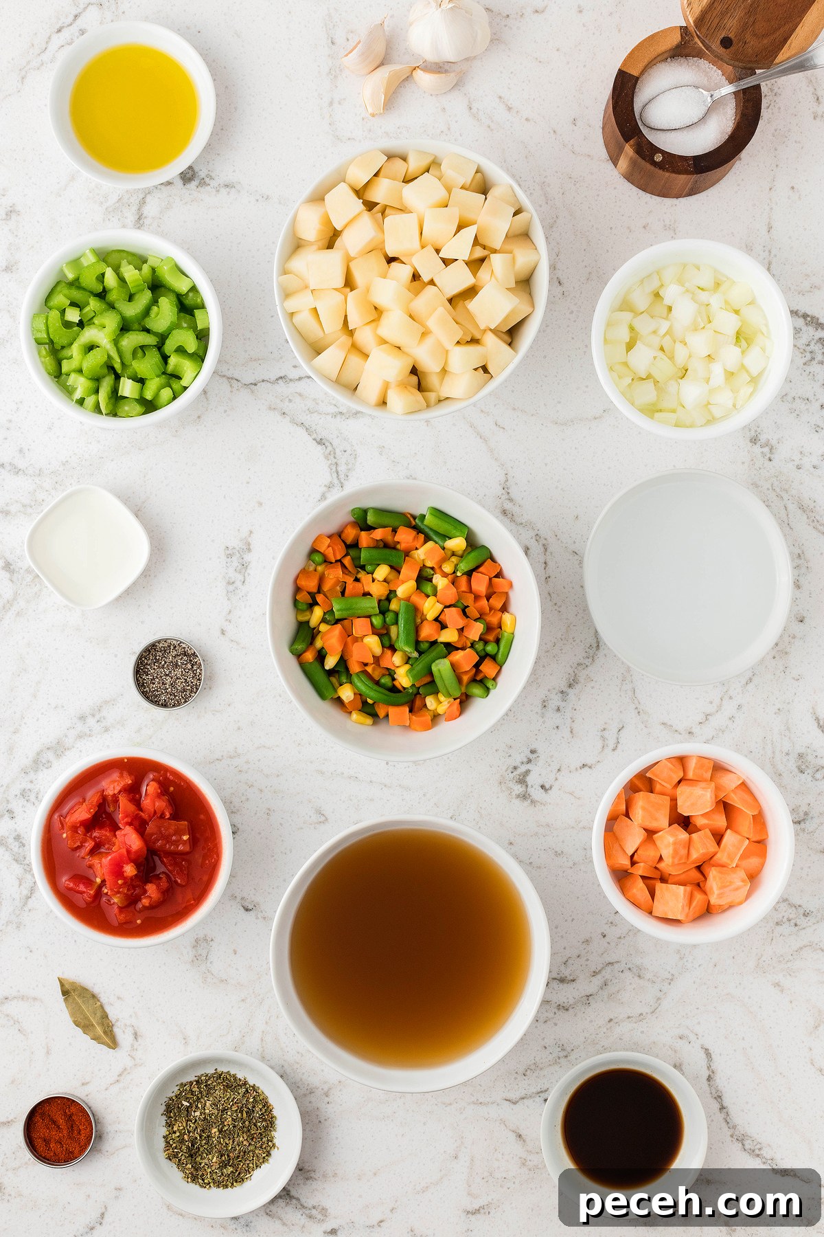 Ingredients for Instant Pot Vegetable Soup arranged in bowls on a white countertop, including fresh and frozen vegetables, broth, and seasonings—perfect for making soup in an Instant Pot or pressure cooker.