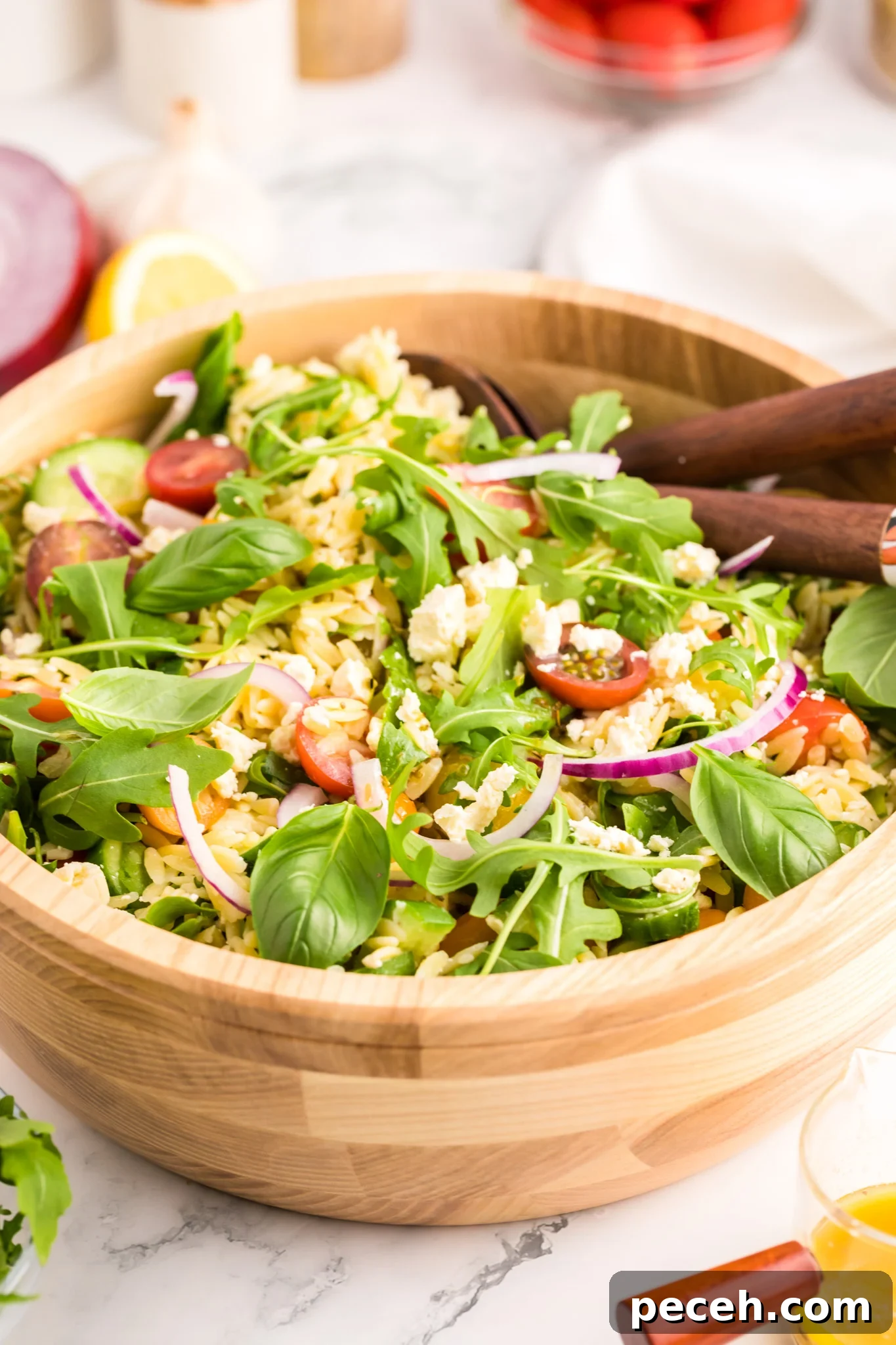 Zesty Arugula and Lemon Orzo Salad with Parmesan 2 Arugula Orzo Salad with wooden spoons.