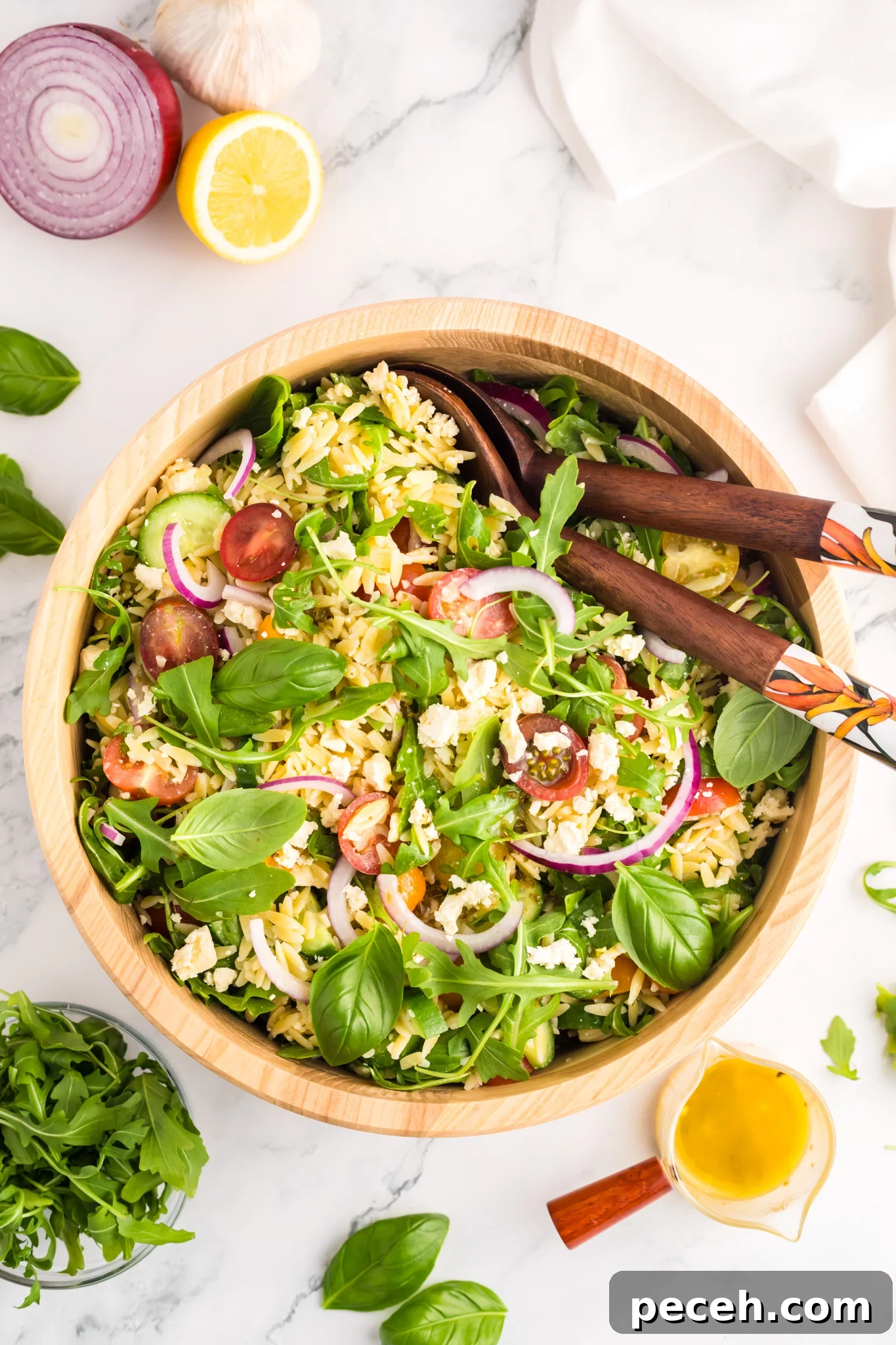 Zesty Arugula and Lemon Orzo Salad with Parmesan 3 Arugula Orzo Salad with wooden spoons.