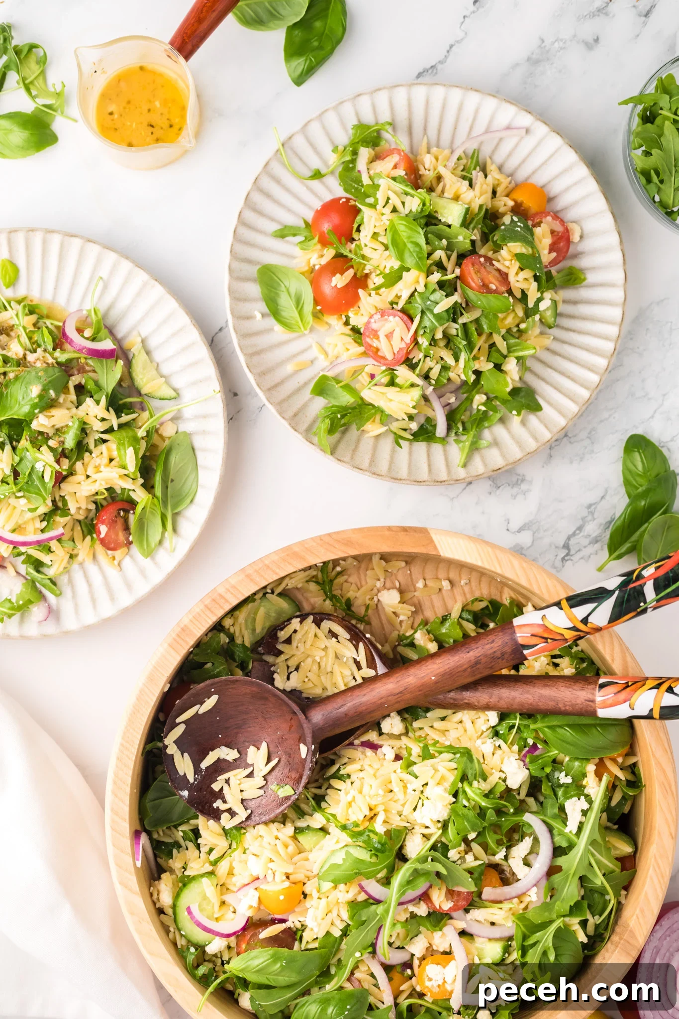Zesty Arugula and Lemon Orzo Salad with Parmesan 7 Arugula Orzo Salad white plates with salad.