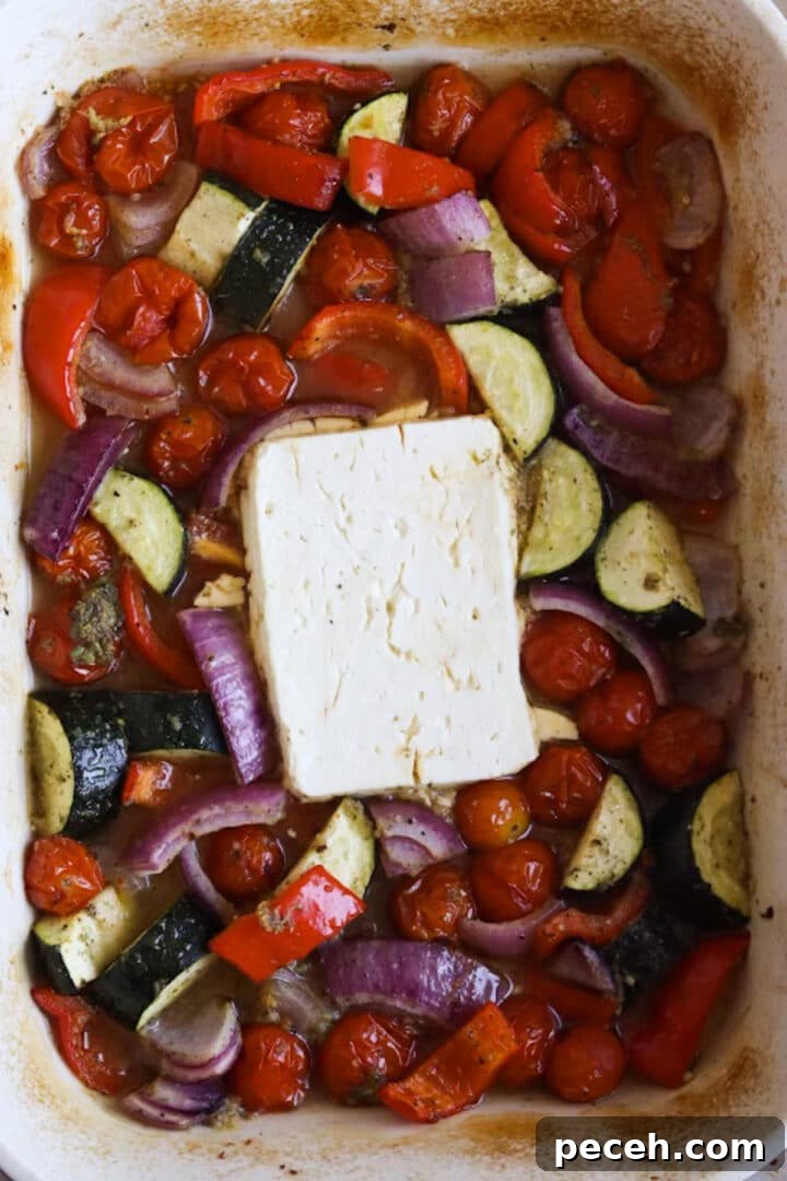 Roasted Feta Pasta with Extra Vegetables 7 Roasted vegetables and large block of feta in a baking dish