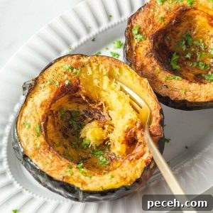 Crispy Air-Fried Acorn Squash Recipe for Fall Side Dish 11 air fryer acorn squash with parsley on a plate with a fork.