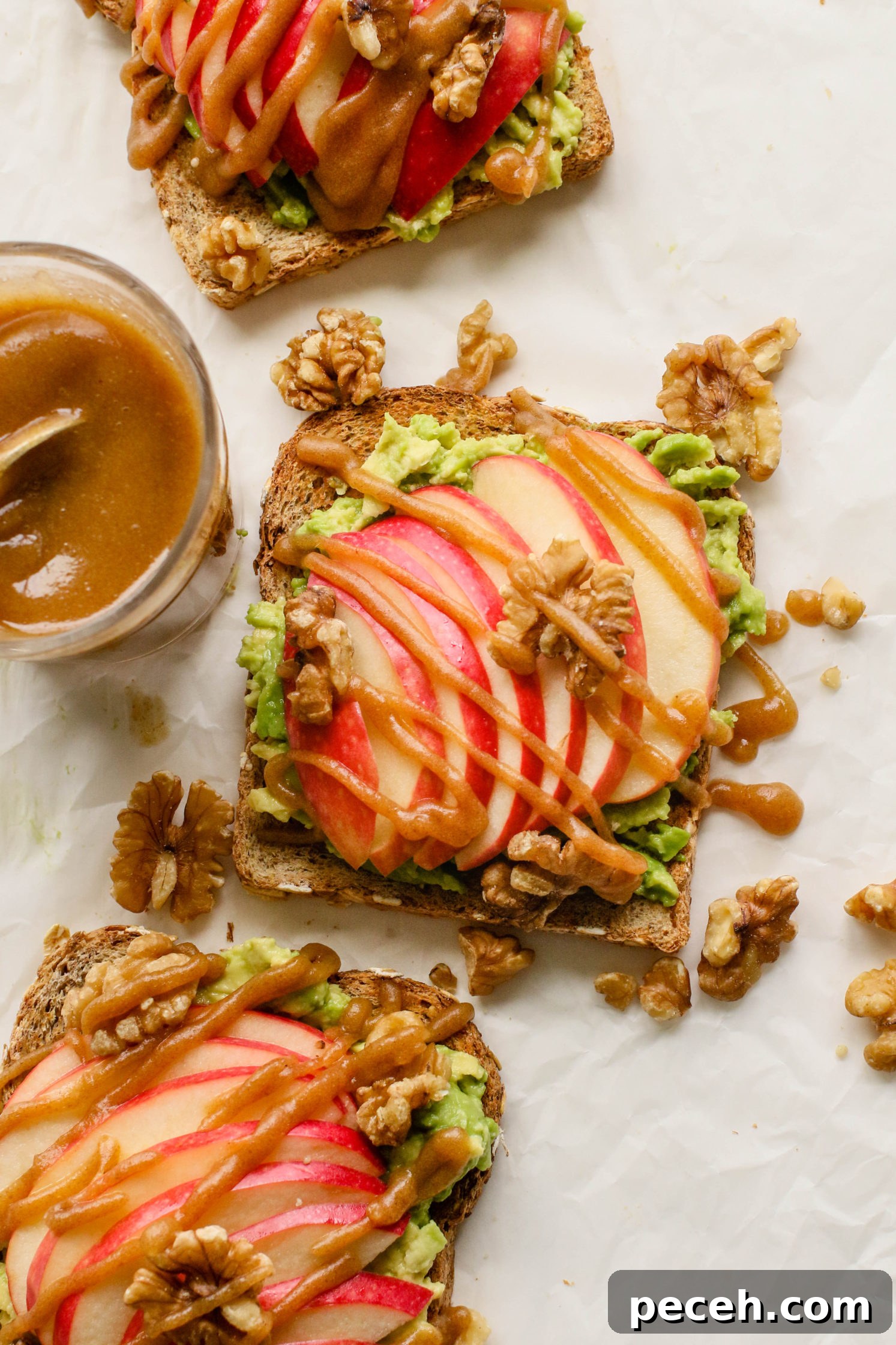 Apple Pie Avocado Toast Recipe: Cinnamon Maple Fall Breakfast 6 apple pie avocado toast served on parchment paper with date caramel drizzled on top