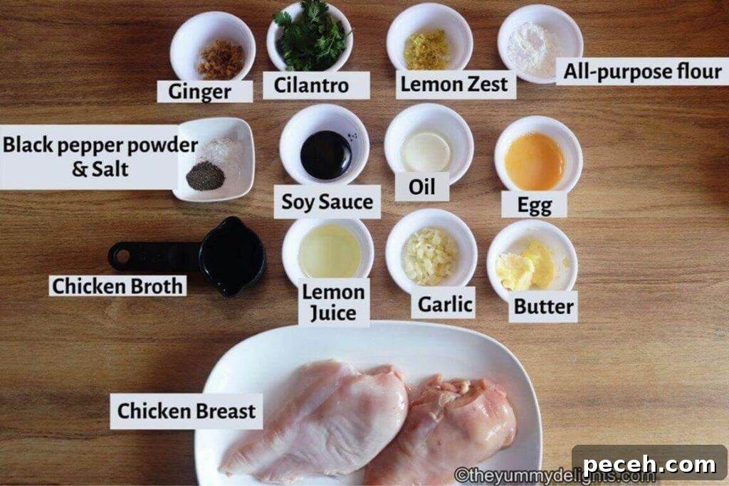 Pan-Seared Lemon Garlic Chicken Breast Recipe 4 individually labeled ingredients to make lemon garlic chicken breast laid out on a table.