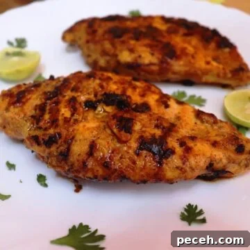 greek yogurt marinated chicken placed on a white plate