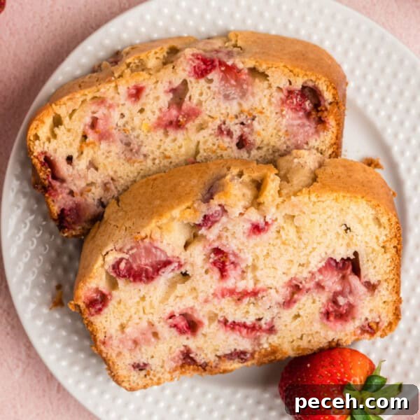 closeup of two slices of strawberry bread on a plate