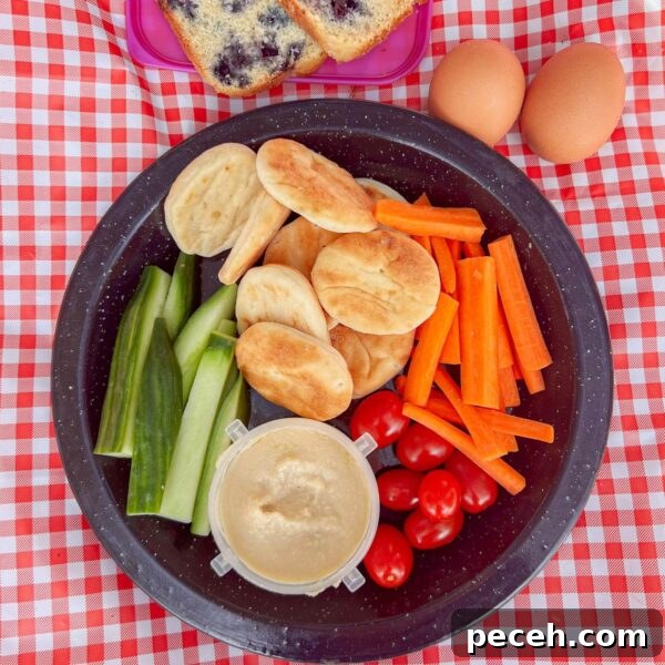 Homemade Hummus: Classic Chickpea or Creamy White Bean Recipe 7 hummus with veggies and pita on gingham