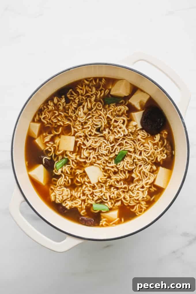 Vegan Ramen Recipe: Fast Homemade Broth and Noodles 11 Vegan ramen in a white pot