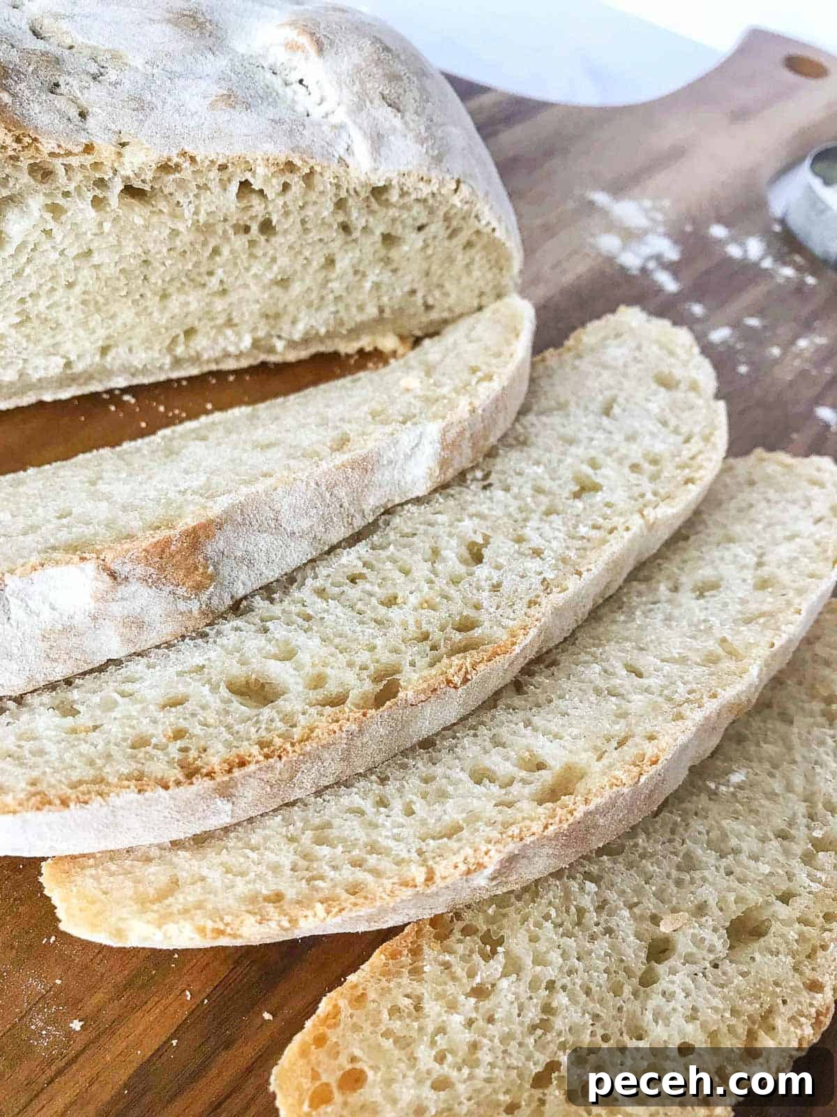 How to Make and Maintain a Sourdough Starter at Home 7 loaf of sliced sourdough bread.