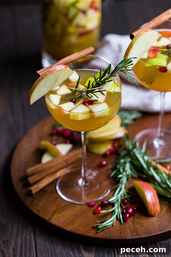 Autumn Harvest White Sangria Recipe for Cozy Fall Gatherings 2 Glasses of autumn harvest white sangria.