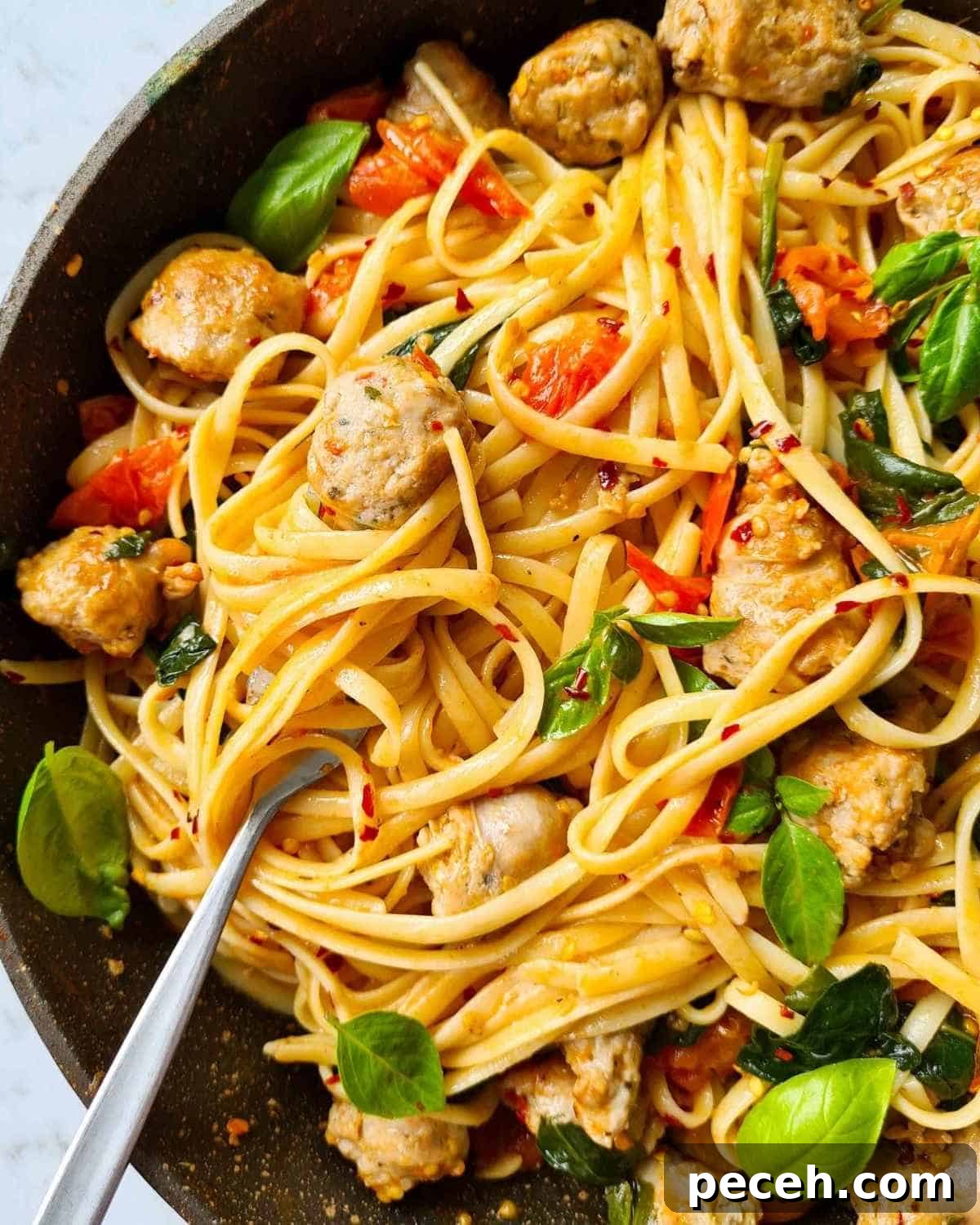 Spicy Italian Sausage Pasta Recipe for Quick Weeknight Dinners 9 Close up of sausage pasta with a fork