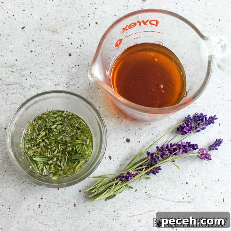 Honey Lavender Syrup Recipe for Lattes, Cocktails & Desserts 5 herb steeping in water next to measuring cup with honey