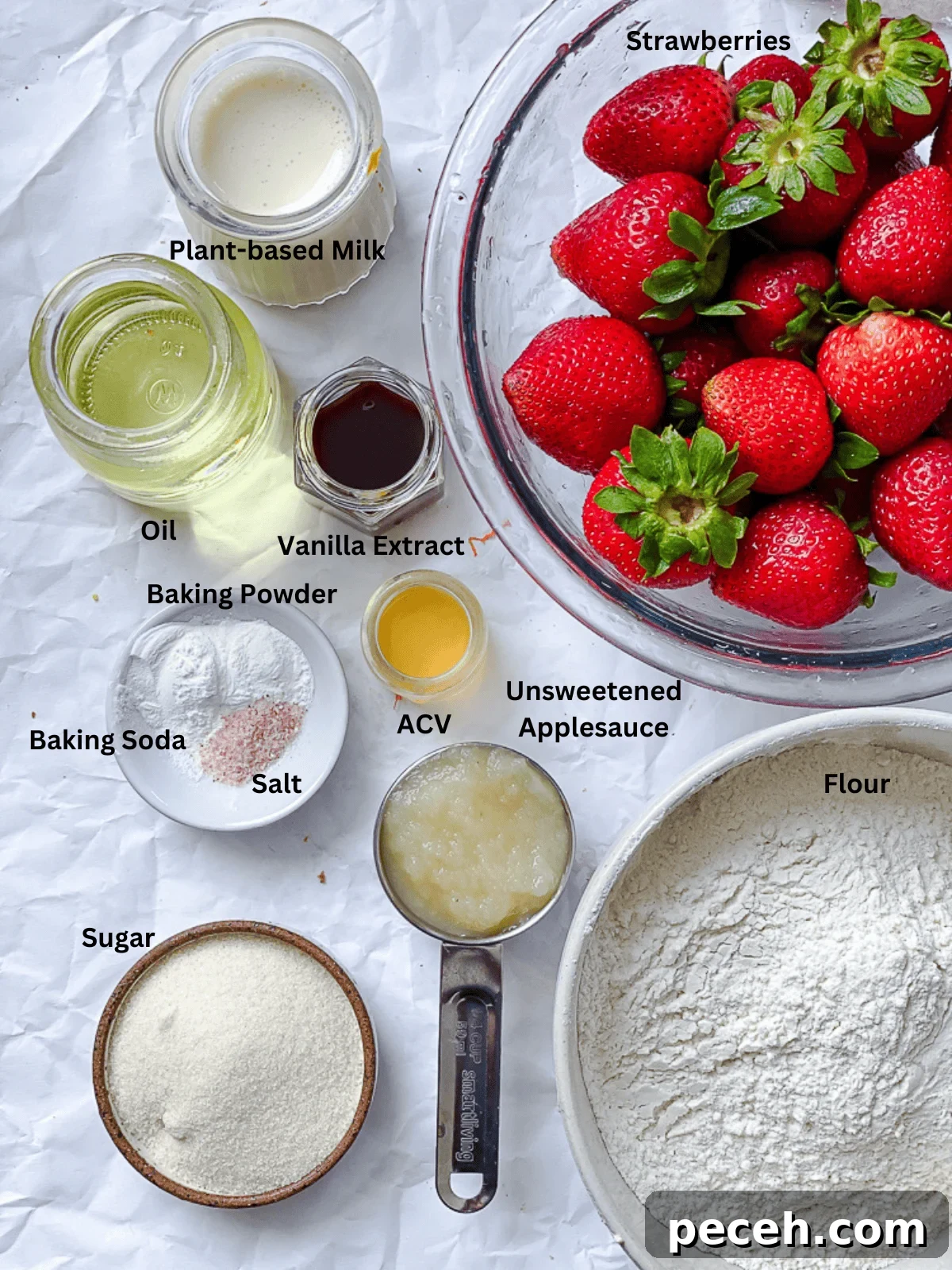 ingredients for Easy Strawberry Bread measured out on white surface