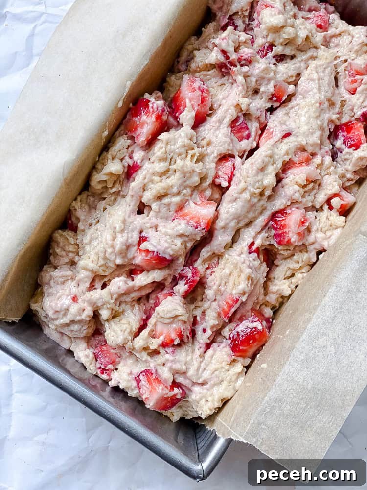 process shot showing batter added to loaf pan