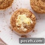 Buttery muffin on a plate.