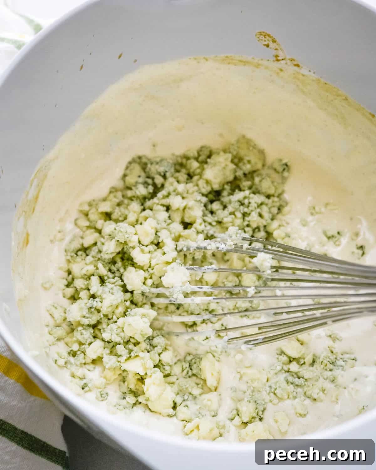Creamy Chunky Blue Cheese Dressing Recipe 5 We are adding blue cheese crumbles to the bowl.