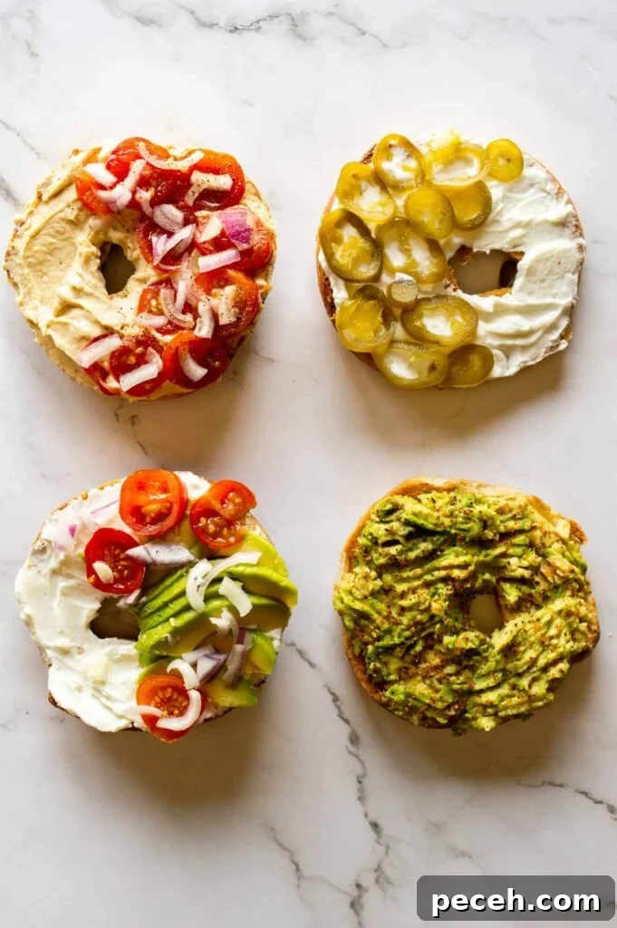16 Vegan Bagel Toppings and Delicious Recipe Ideas 3 four bagel halves topped with savory vegan toppings like smashed avocado, hummus and vegan cream cheese