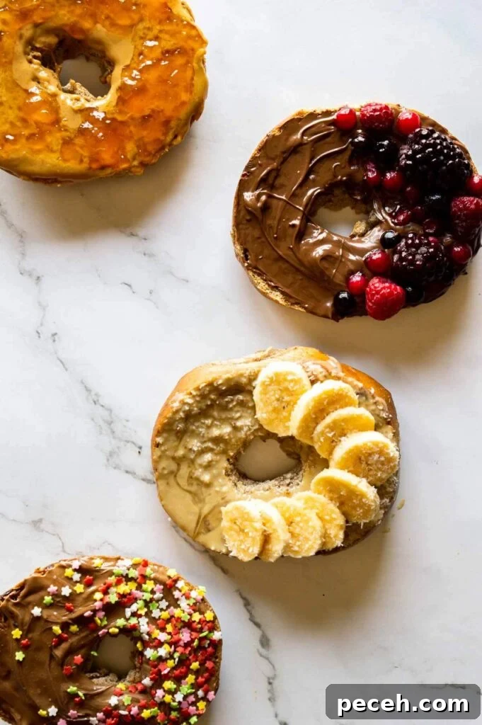 16 Vegan Bagel Toppings and Delicious Recipe Ideas 4 four halved bagels topped with sweet vegan toppings like tahini, peanut butter and vegan chocolate spread