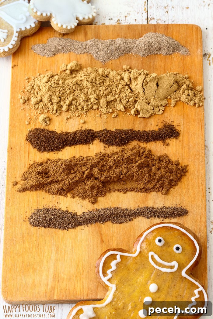 How to Make Homemade Gingerbread Spice Mix Image Wooden board with neat rows of ground spices used to make gingerbread mix.