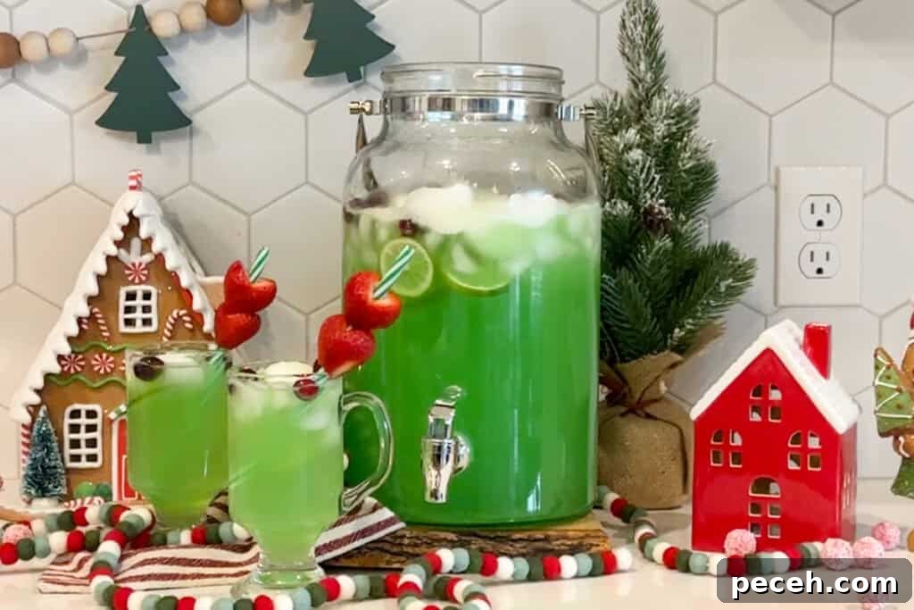 Grinch Punch Recipe: Festive Green Holiday Cocktail 5 Green grinch holiday punch on a table with Christmas decorations.