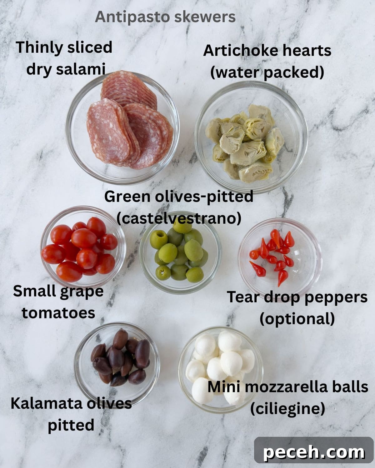 Ingredients for antipasto skewers in prep bowls ready for assembly.