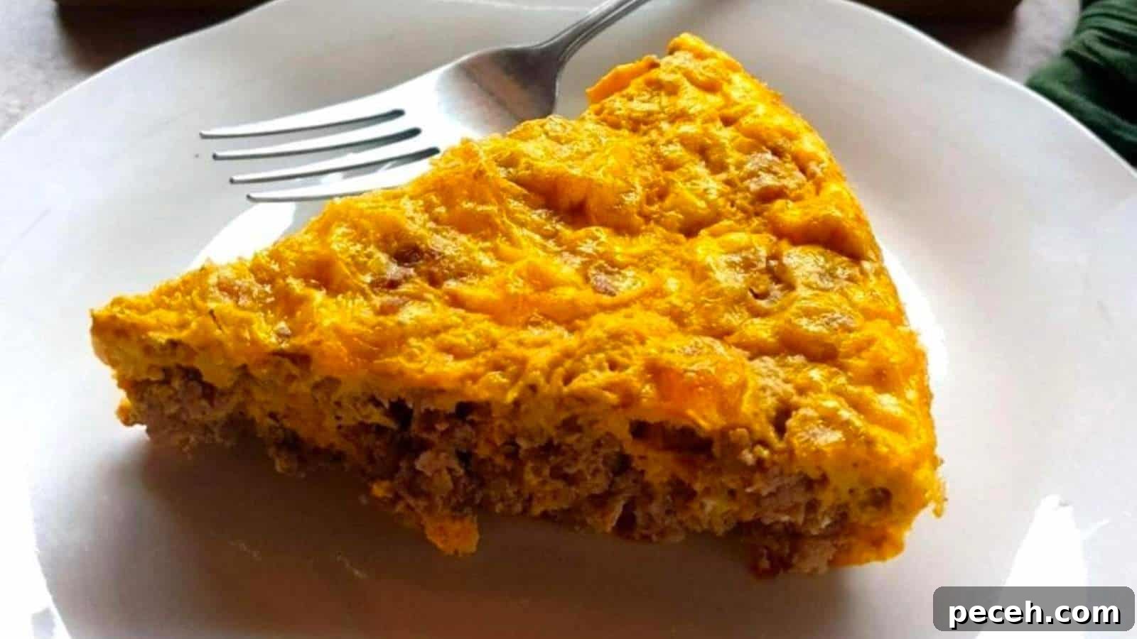 A person cutting a piece out of a casserole.