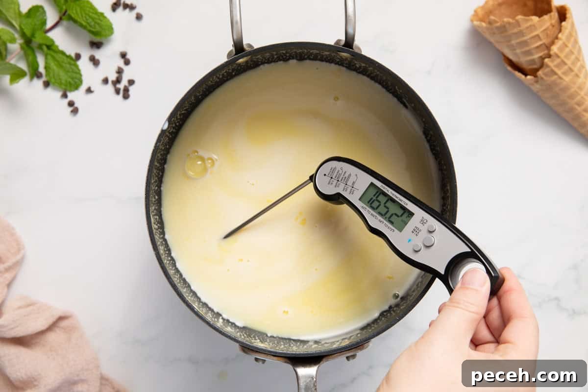 A thermometer showing an ice cream mixture has reached 165 degrees Fahrenheit.