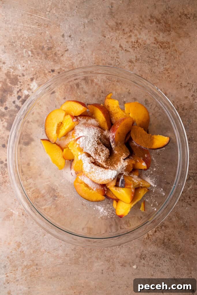 Classic Old-Fashioned Peach Cobbler Recipe You’ll Love 6 peaches and sugar in a bowl