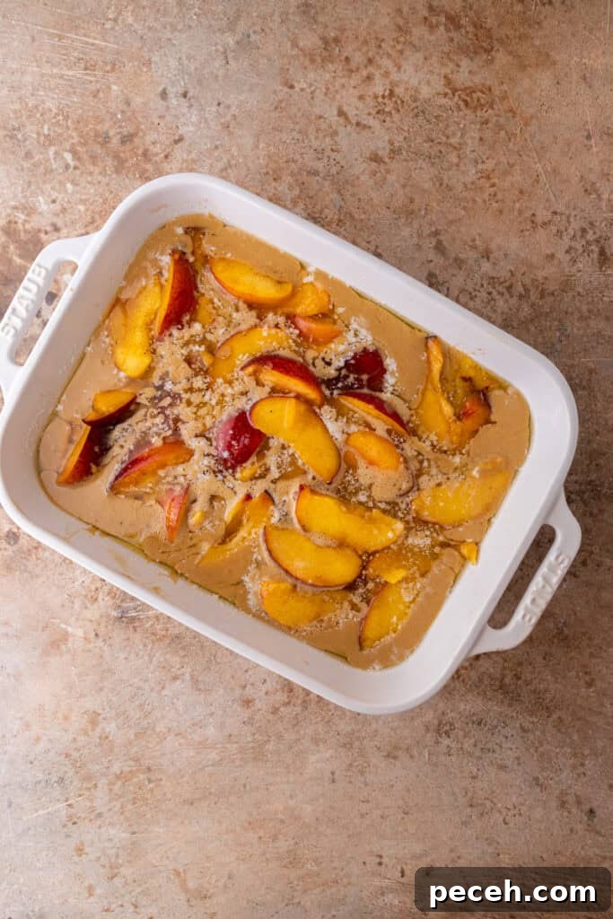 Classic Old-Fashioned Peach Cobbler Recipe You’ll Love 9 batter and fruit in a dish