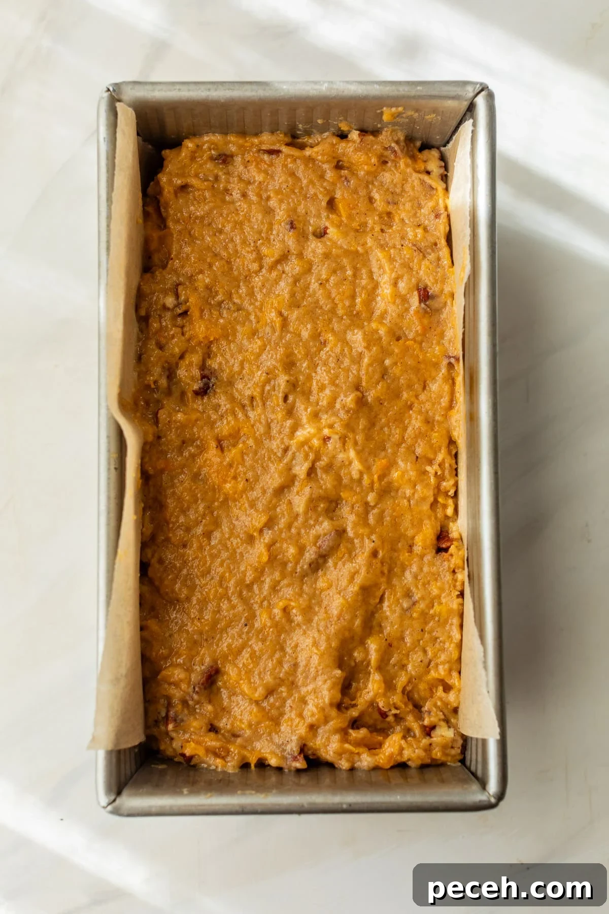 Moist Butternut Squash Loaf Recipe for Fall Baking 7 the batter for butternut squash bread in a loaf pan.