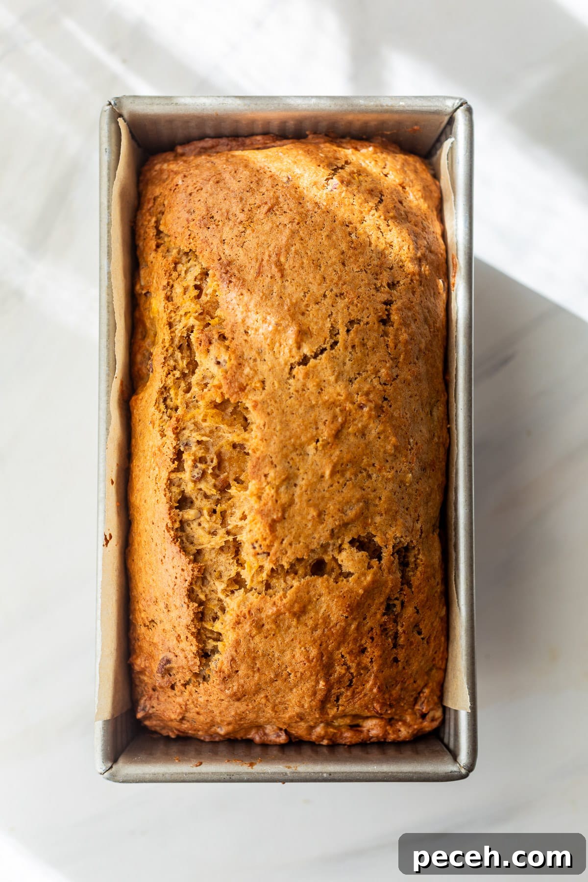 Moist Butternut Squash Loaf Recipe for Fall Baking 8 baked butternut squash bread in a loaf pan.