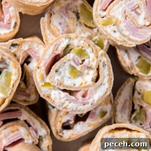 Quick Crowd-Pleasing Party Appetizers for Any Gathering 4 ham and cheese pinwheels stacked on a plate