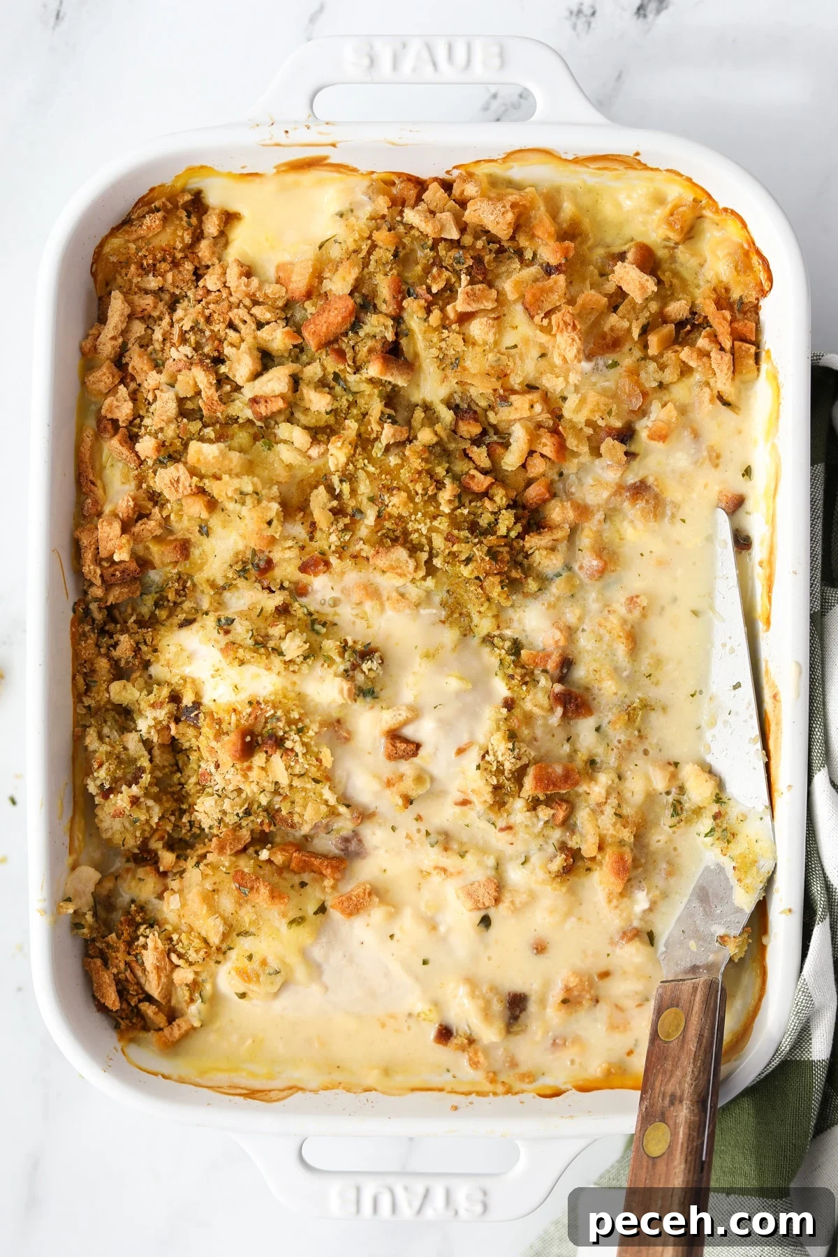 Creamy Swiss-Style Chicken Casserole with Mushrooms and Cheese 15 A baking dish filled with chicken and stuffing casserole.