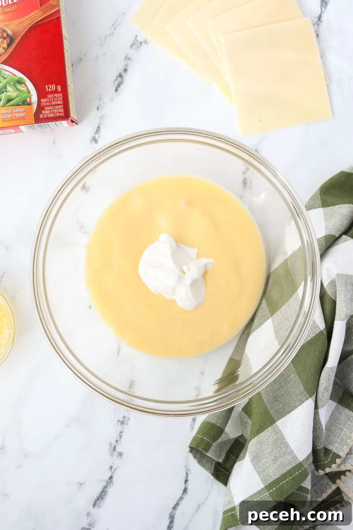 Creamy Swiss-Style Chicken Casserole with Mushrooms and Cheese 4 A bowl with cream of chicken soup and sour cream.