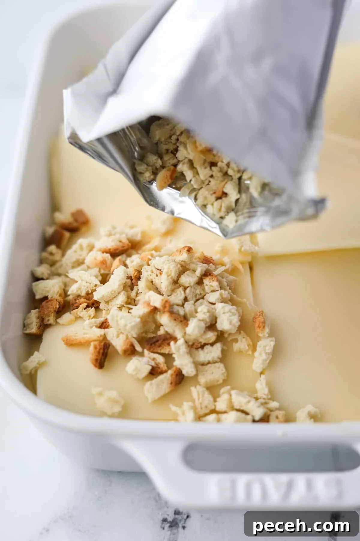 Creamy Swiss-Style Chicken Casserole with Mushrooms and Cheese 9 Sprinkling stuffing mix on top of a casserole.