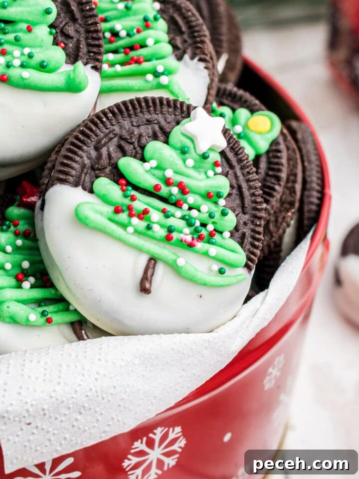 Snowflake Sugar Cookies: Festive Icing & Decorating Guide 5 A tin of christmas oreo cookies with a christmas tree on it.