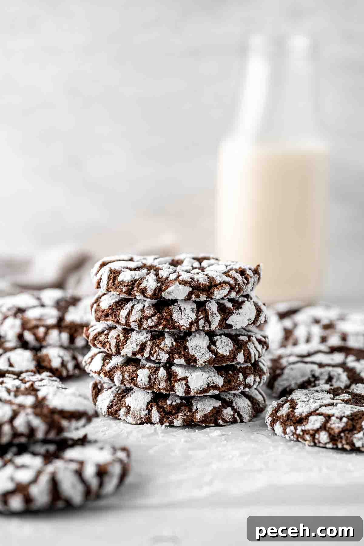 Fudgy Chocolate Crinkle Cookies Recipe 2 Close up of a stack of 5 chocolate crinkle cookies.