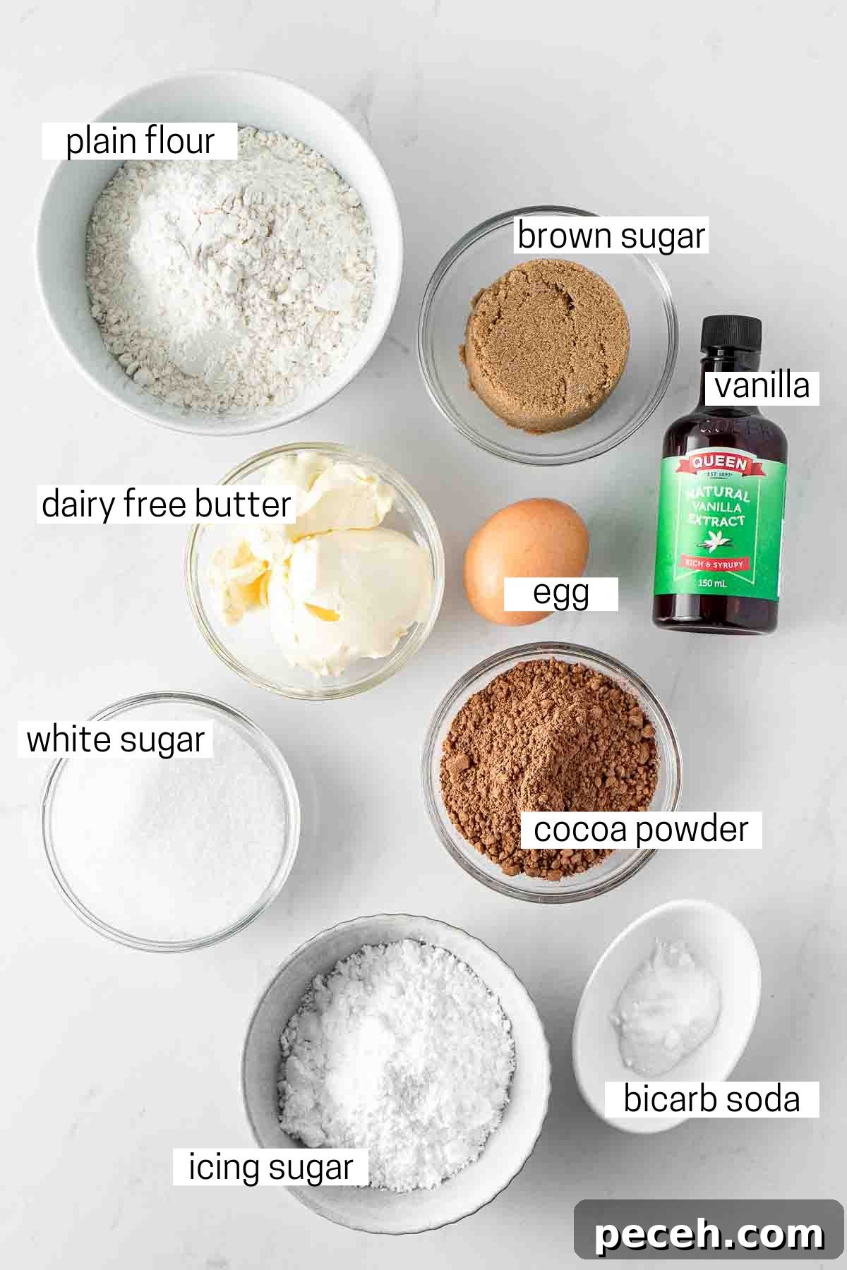 Fudgy Chocolate Crinkle Cookies Recipe 3 All ingredients needed for chocolate crinkle cookies laid out in small bowls.