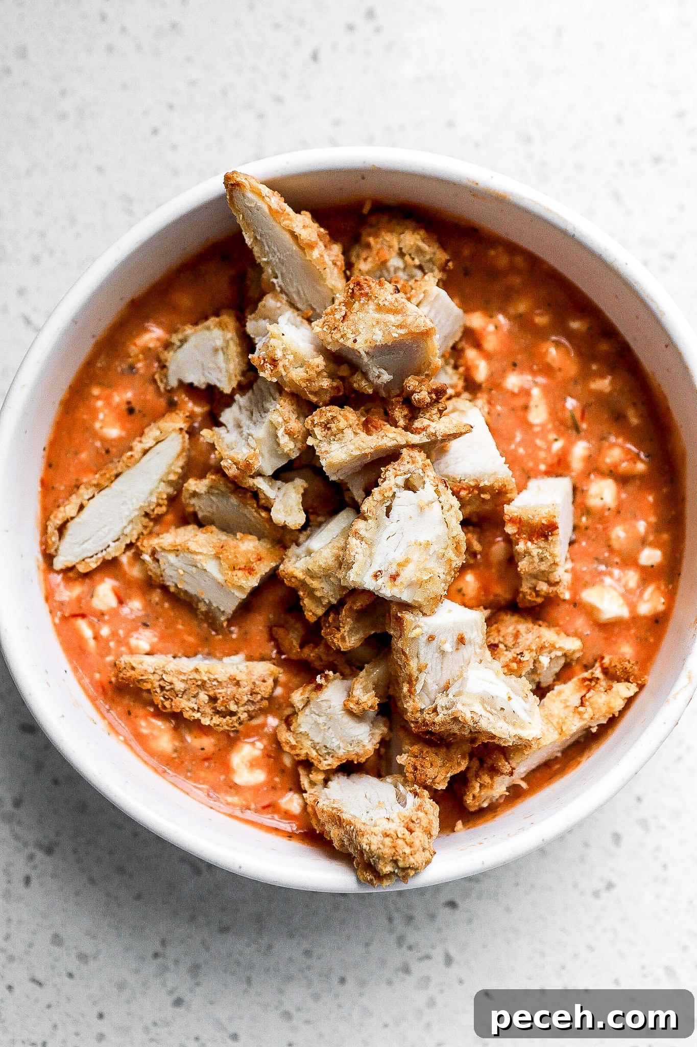 Chicken Parmesan Bowl with Cottage Cheese 3 Top down view of chicken parm bowl with breaded chicken on top.