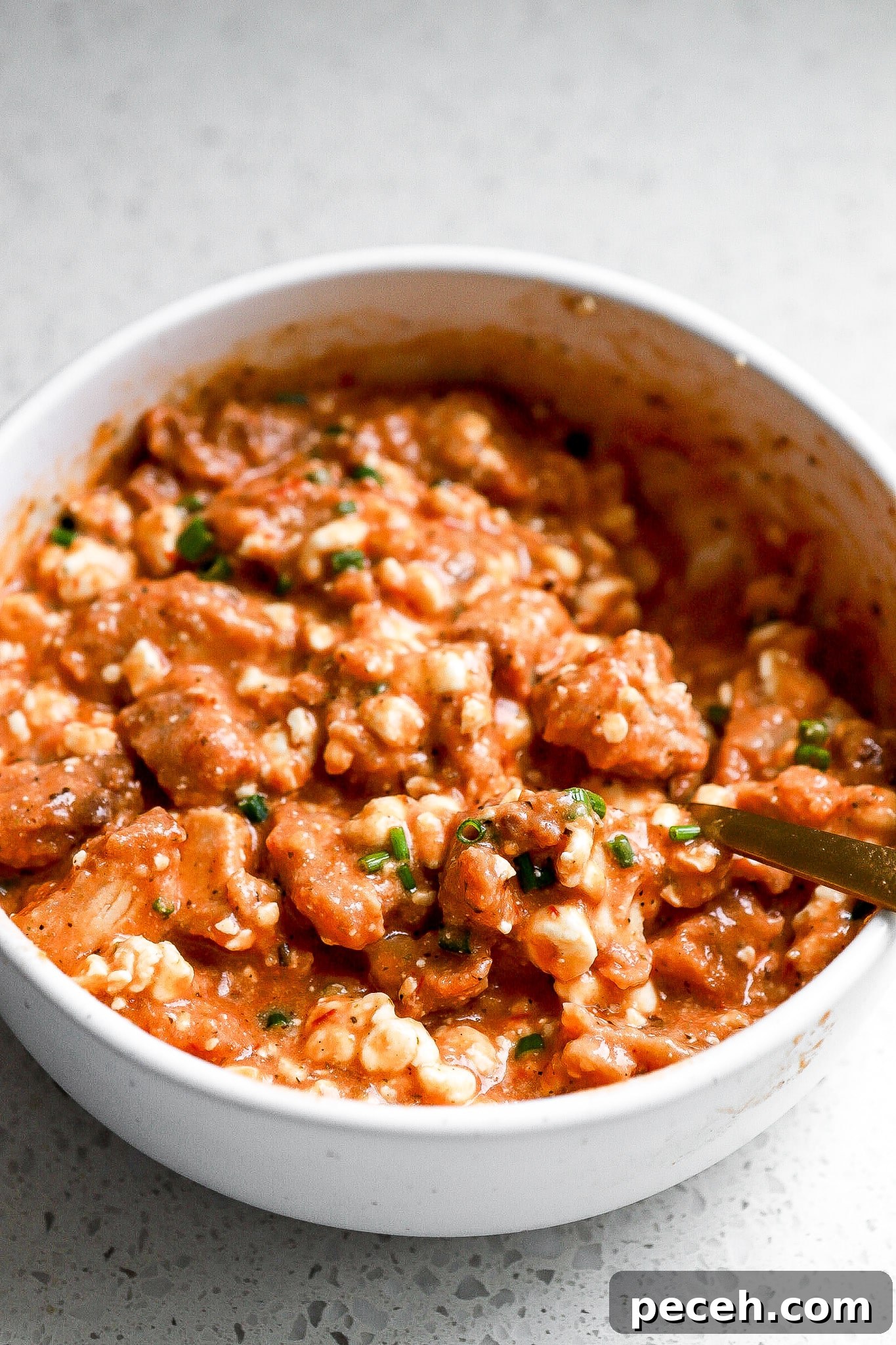 Chicken Parmesan Bowl with Cottage Cheese 6 Side view of the viral protein chicken parm bowl with fresh chives.