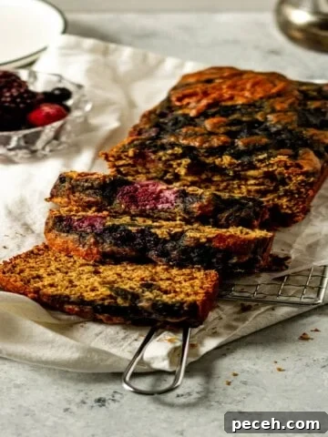 slices cut from pb & j banana bread on a white cloth
