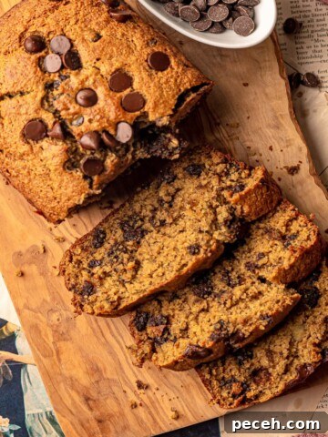 Slices of chocolate chip banana bread on a cutting board.